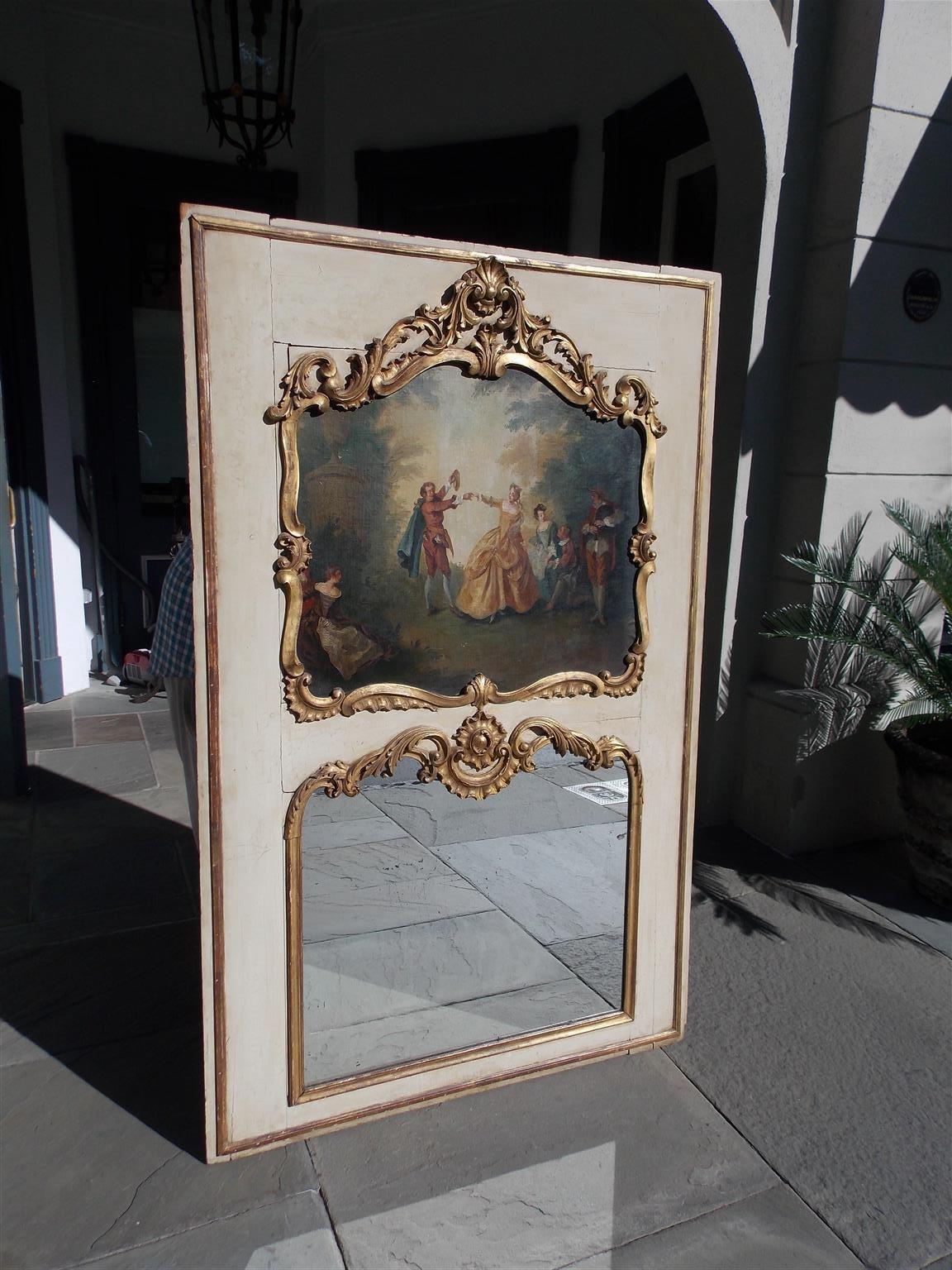 French Louis XV gilt and painted trumeau mirror with a figural landscape painting, embellished shells, foliate scrolls, and retains the original shaped mirror with surrounding gilt foliage. The mirror retains the original paneled wood backing as