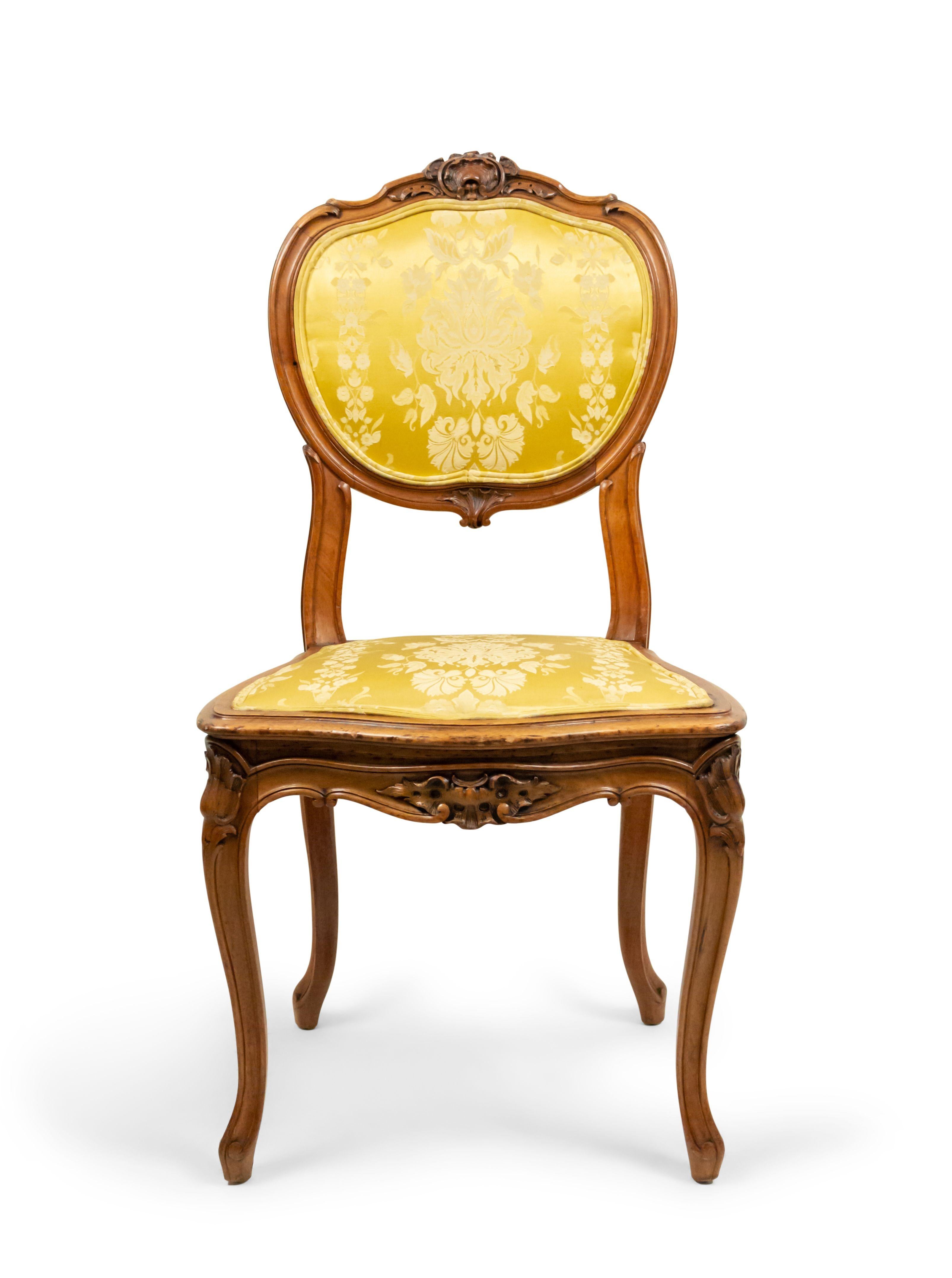 Set of 10 French Louis XV style (19th Century) walnut side chairs with gold damask upholstered seat and oval back (signed E. DELMAS) (PRICED AS Set)

Three of the chairs have tears in their upholstery.