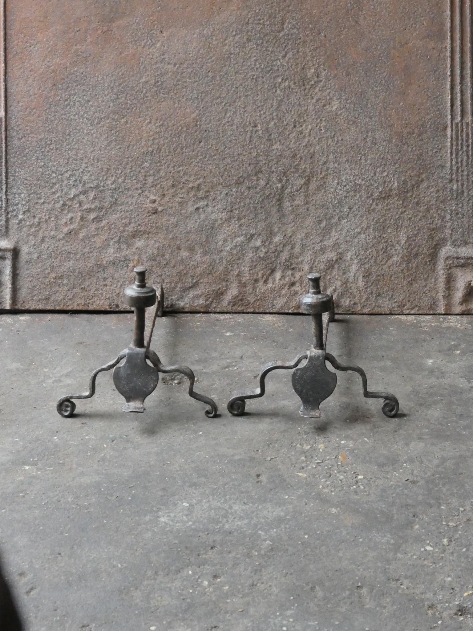 18th century French Louis XV andirons. Made of wrought iron. The andirons are in a good condition and are fully functional.