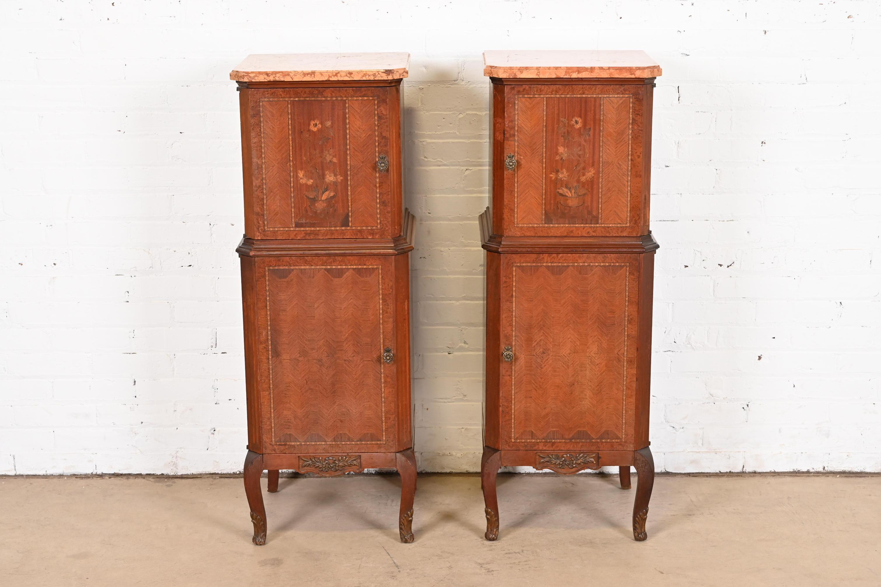 A gorgeous pair of French Louis XV style lingerie chests or tall beside chests

France, Circa 1920s

Beautiful kingwood and burl wood, with floral inlaid marquetry, beveled pink Italian marble tops, and original brass hardware.

Measures: 16