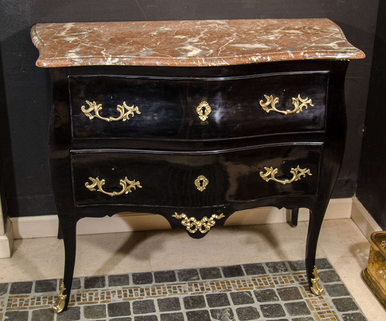 A fine French Louis XV marble-top black lacquered bronze-mounted serpentine commode. 18th century.