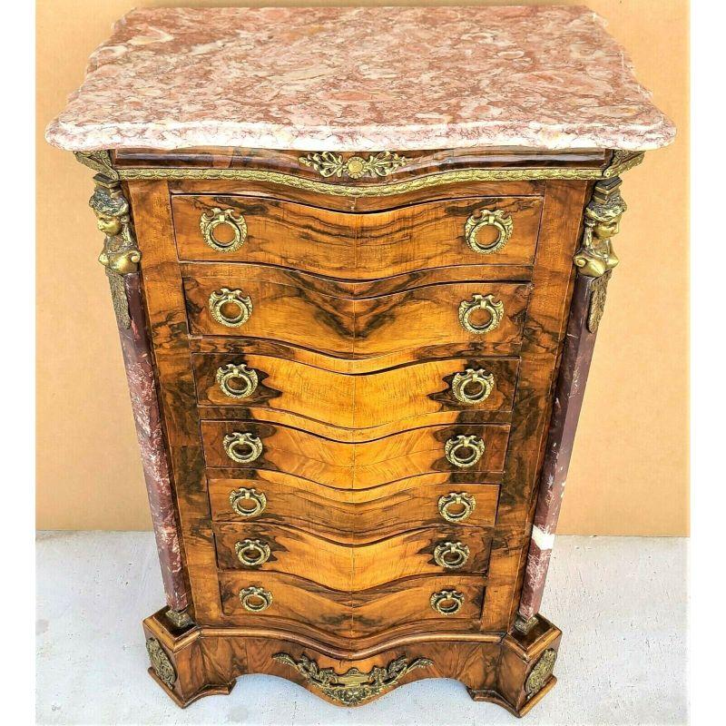 Offering one of our recent palm beach estate fine furniture acquisitions of a 
French Louis XV style marble top lingerie press chest dresser with gilt ormolu mounts

With marble columns adorning both front sides and 7 drawers.
All of the insides of