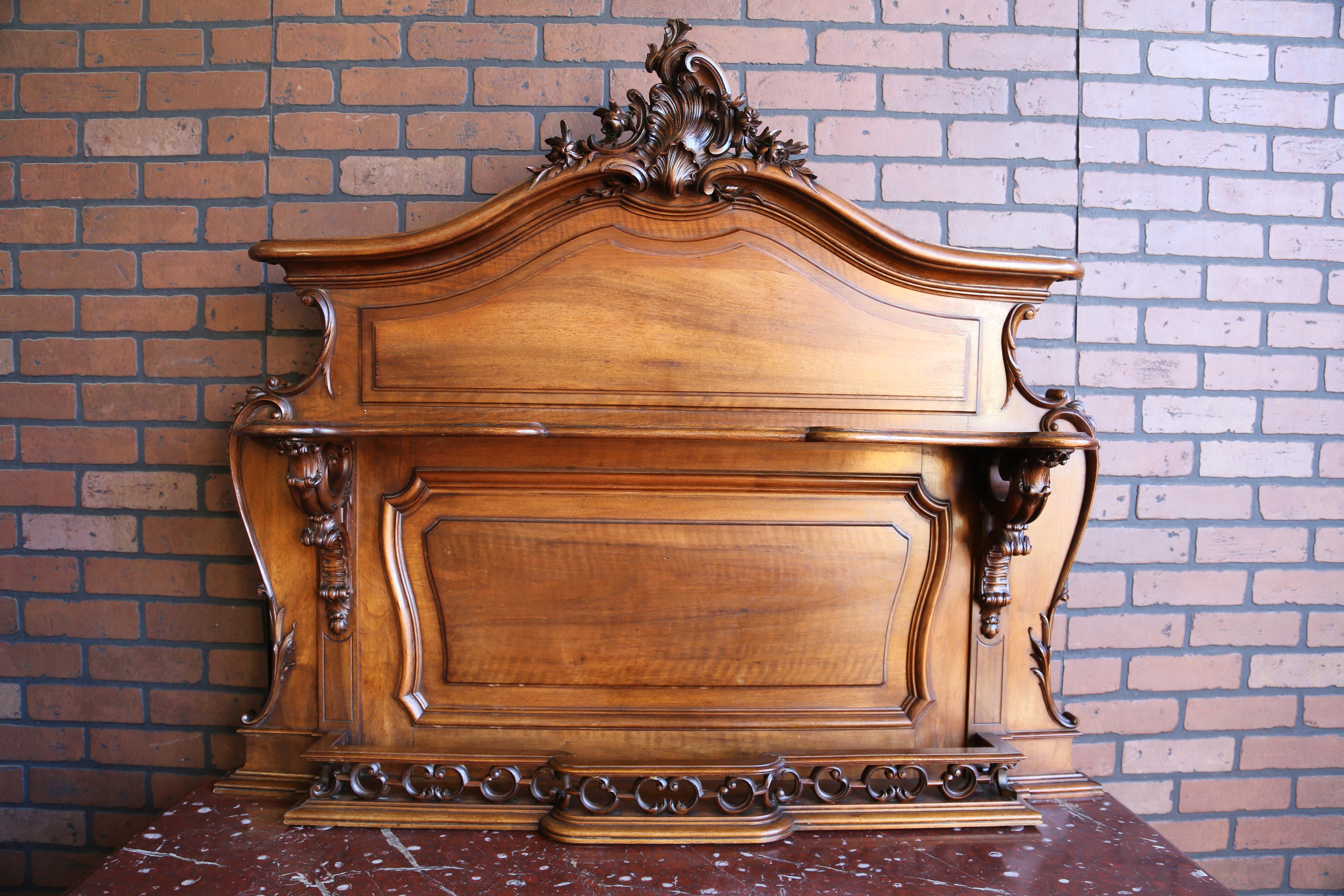 Splendid French marble top Vaisselier. Adorned with magnificent carvings from the sweet flowers on the raised door panels, to the center details of the scalloped aprons, again at the upper corners of the base and top of the cabriole legs, and of