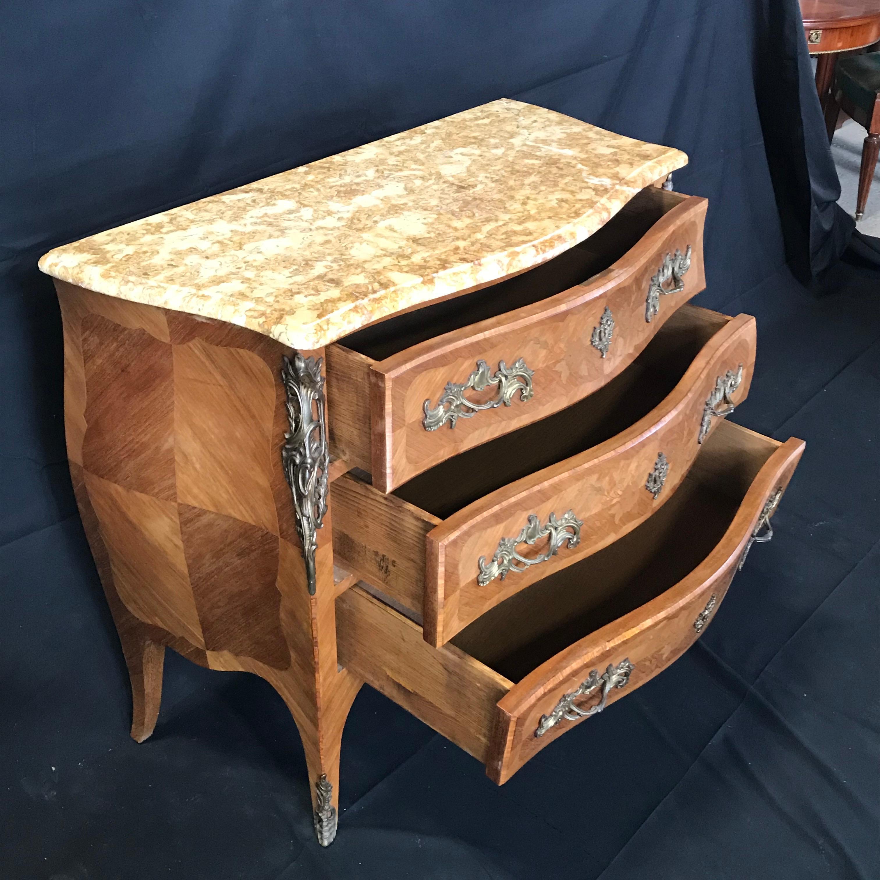 Beautiful French Louis XV marquetry walnut commode having 3 drawers, brass hardware and caramel and cream beveled marble top – all original.
#442.