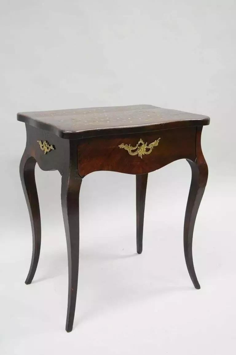 Antique French Louis XV Style Napoleon III Rosewood and Brass Inlay Vanity Nightstand Sewing Table. Item features shapely cabriole legs, beautiful rosewood veneers, dovetailed central drawer and bronze ormolu. The ornate top flips up to display a
