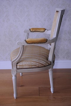 French Louis XV, Neoclassical Bergère Armchair with Moulded Motifs, Gilt Studs