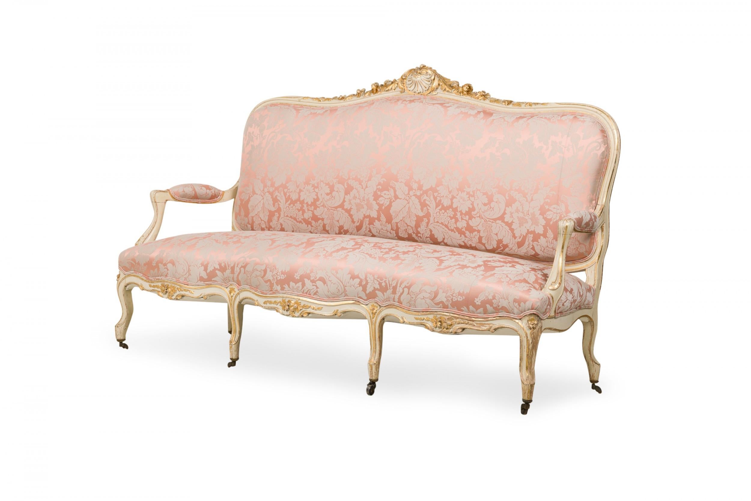 SET of 5 French Louis XV style (19th Cent) white and gilt painted living room set with carved back crests and complimentary upholstery (Sofa, 4 armchairs)

Condition: (Recently reupholstered. Upholstery does not match photos.)