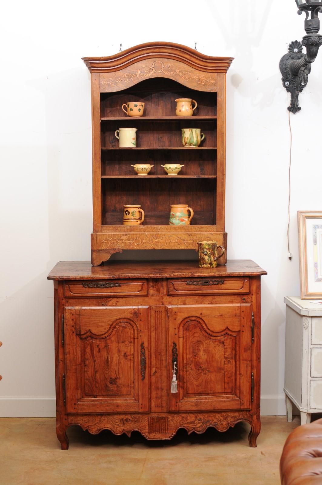 A French Louis XV period ash rustic buffet from the mid-18th century, with two drawers over two doors. Created in France during the reign of King Louis XV nicknamed 