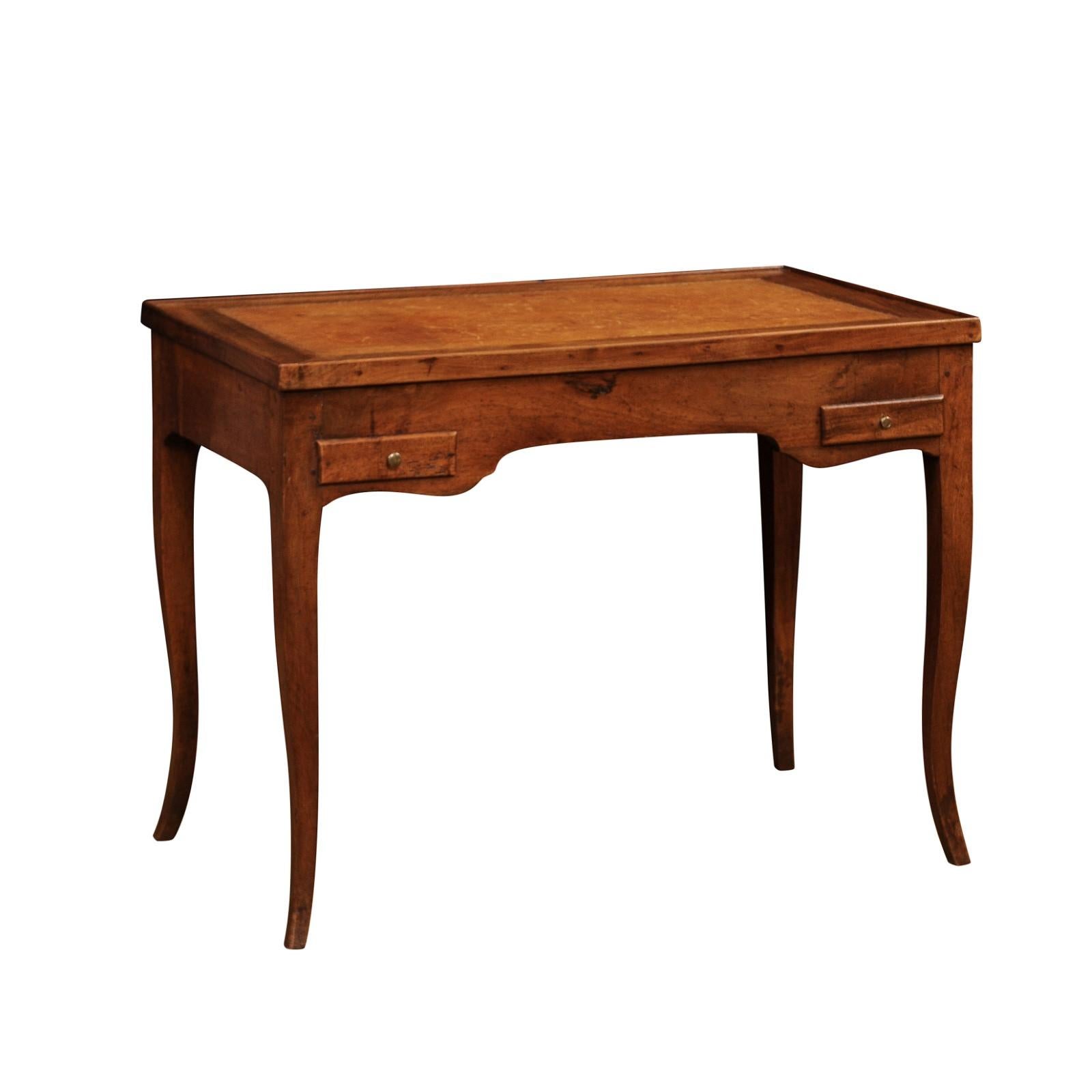 A French Louis XV period walnut tric trac game table from the late 18th century with removable top, two drawers and cabriole legs. Created in France towards the end of the reign of King Louis XV nicknamed Le Bien-Aimé in the third quarter of the