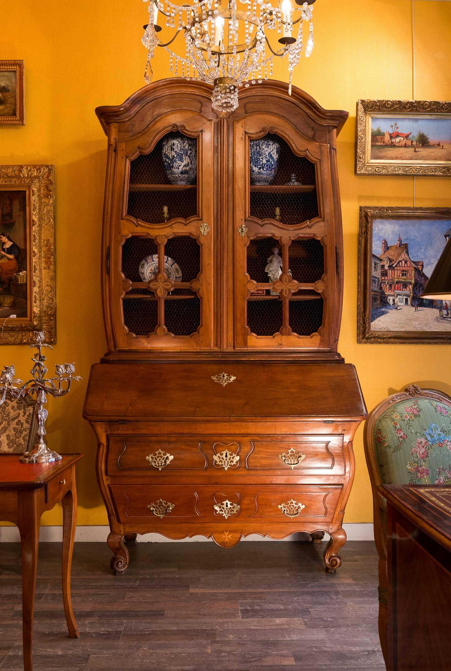 A magnificent, rare and unique French Louis XV period, circa 1740, walnut bombe commode, and slant-dest, and « two-bodies », elegant and sophisticated piece furniture.

We can be described this piece of furniture in several different ways: It is a