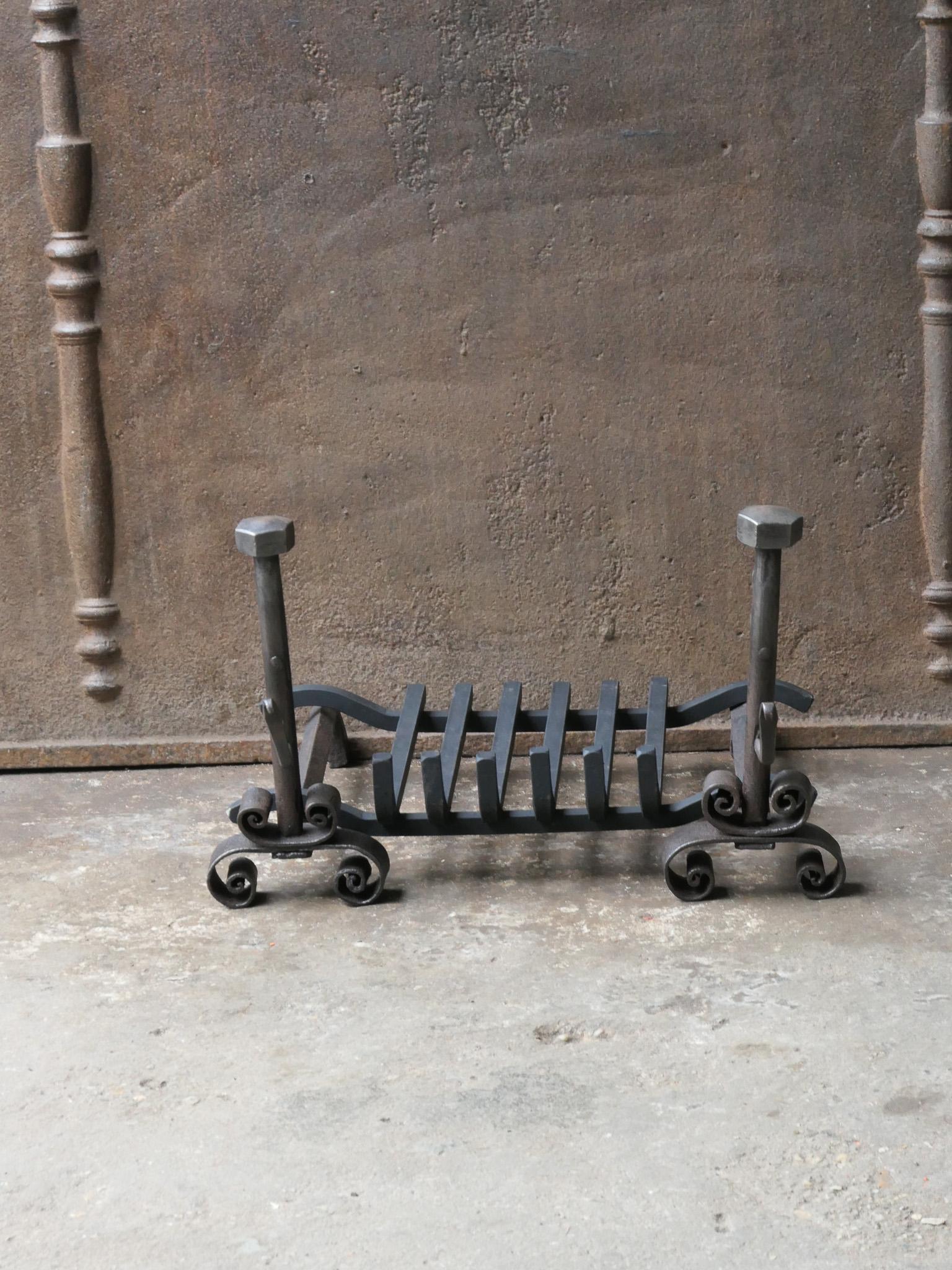 18th - 19th century French Louis XV period andirons made of wrought iron with a recently forged grate. The condition is good.

The total width at the front is 48 cm / 18.9 inches.




  