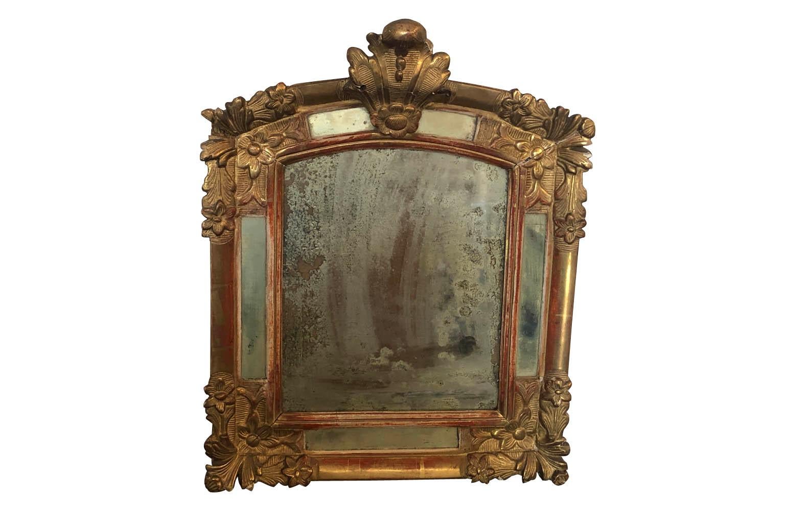 A very beautiful French Louis XV mirror wonderfully constructed from giltwood. The mirror effect is produced with silver leaf instead of mercury. A stunning accent piece.