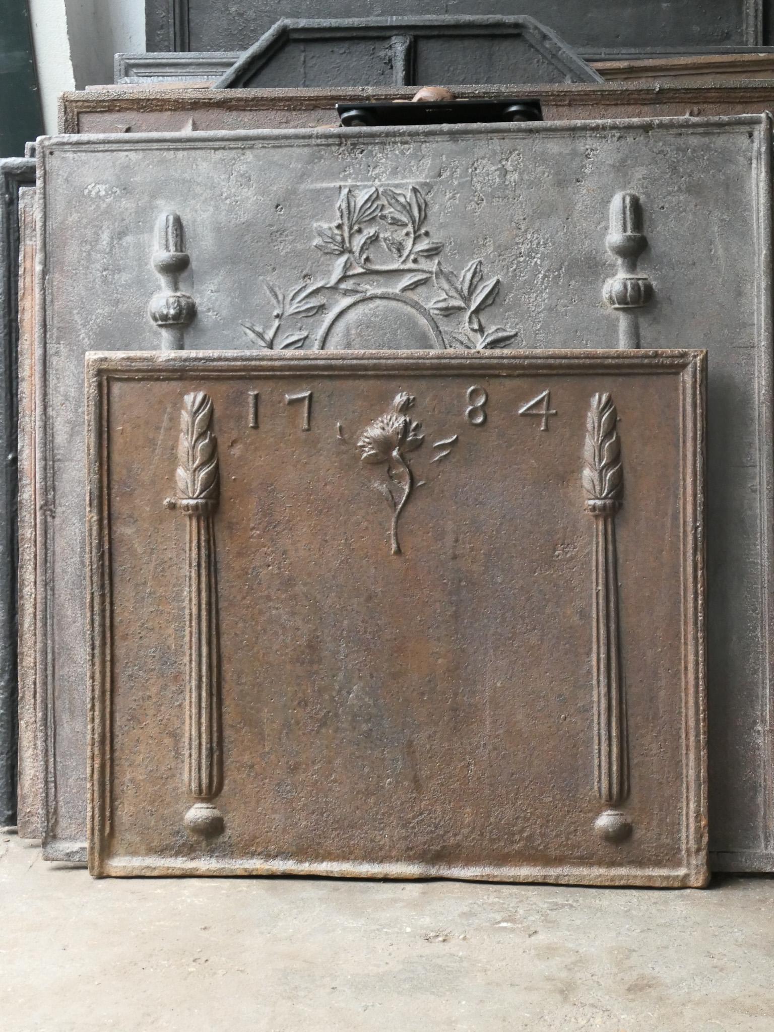 18th century French Louis XV fireback with two pillars. The date of production, 1784, is also cast in the fireback.

The fireback is made of cast iron and has a natural brown patina. Upon request it can be made black / pewter at no extra cost. It