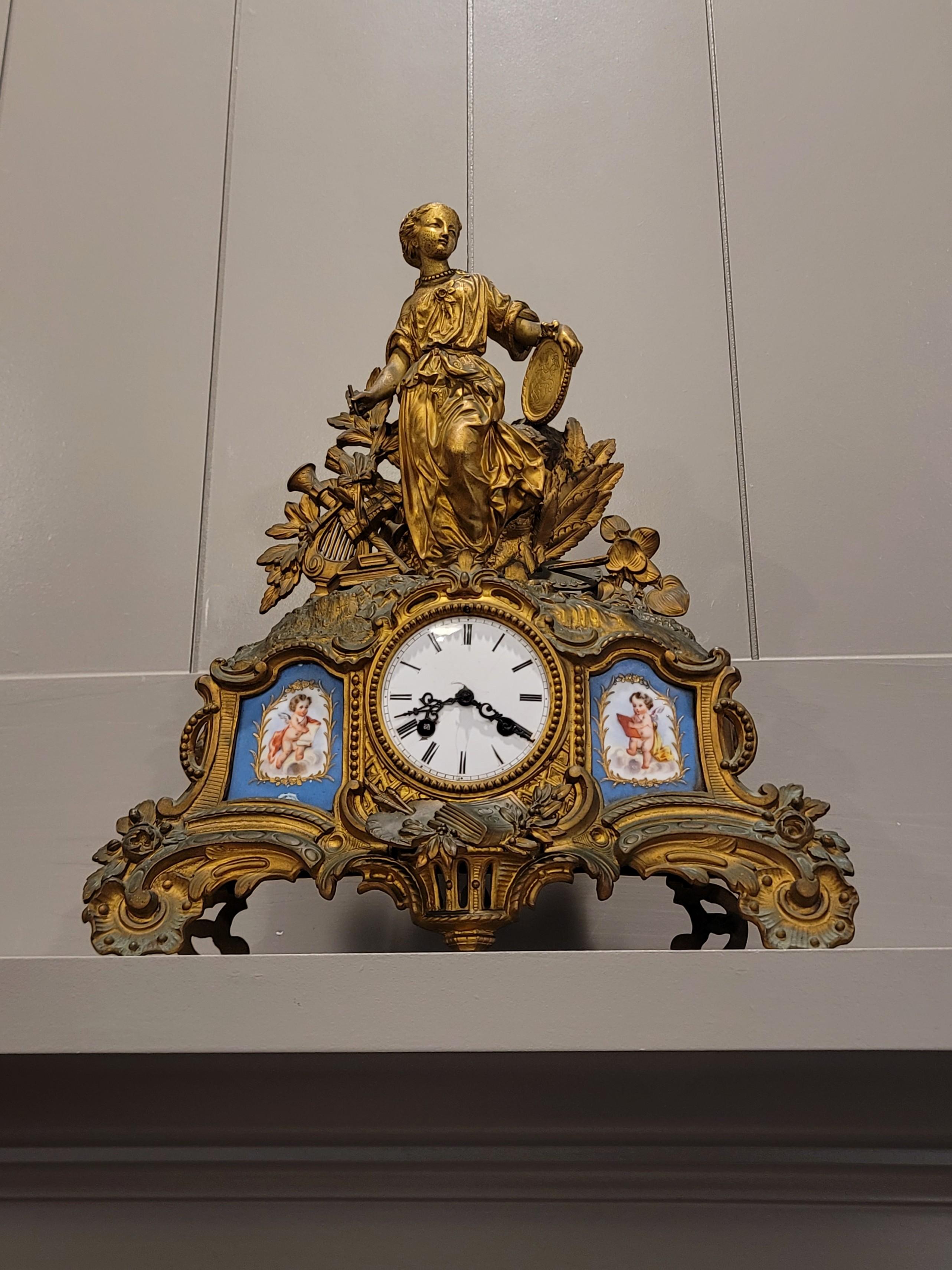 A fabulous French antique, circa 1850, Sevres style porcelain mounted gilt metal mantel clock by Parisian sculptor and merchant Louis Hottot (1829-1905), with stamped Japy Freres silk thread suspension movement.

Born in Paris, France, in the