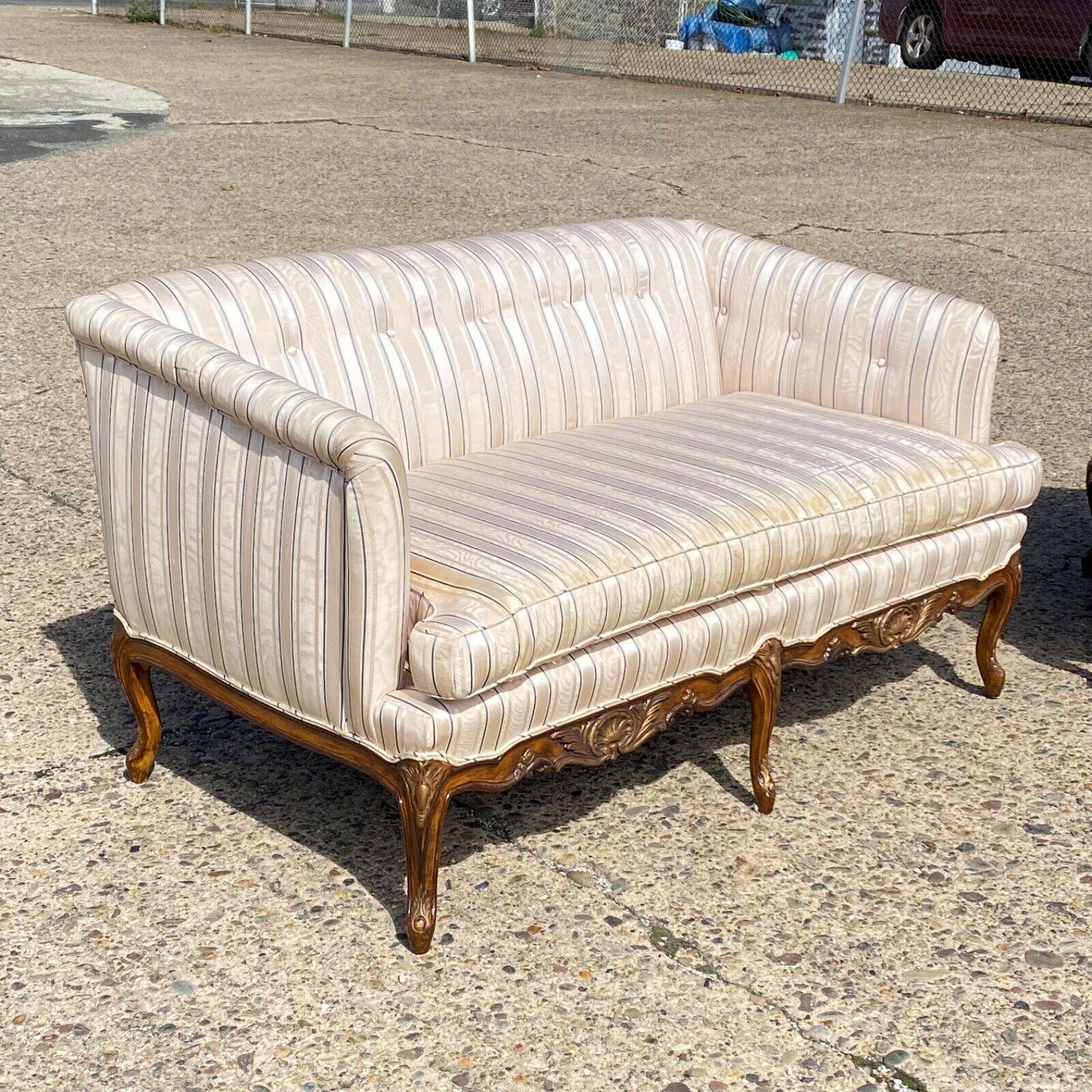 Vintage French Louis XV Provincial Style Upholstered Loveseat Sofa Settee Set- a Pair. Item features solid wood construction, shapely carved cabriole legs with gold accents, slightly rolled arms, wonderful frames to reupholster. Circa Mid to Late