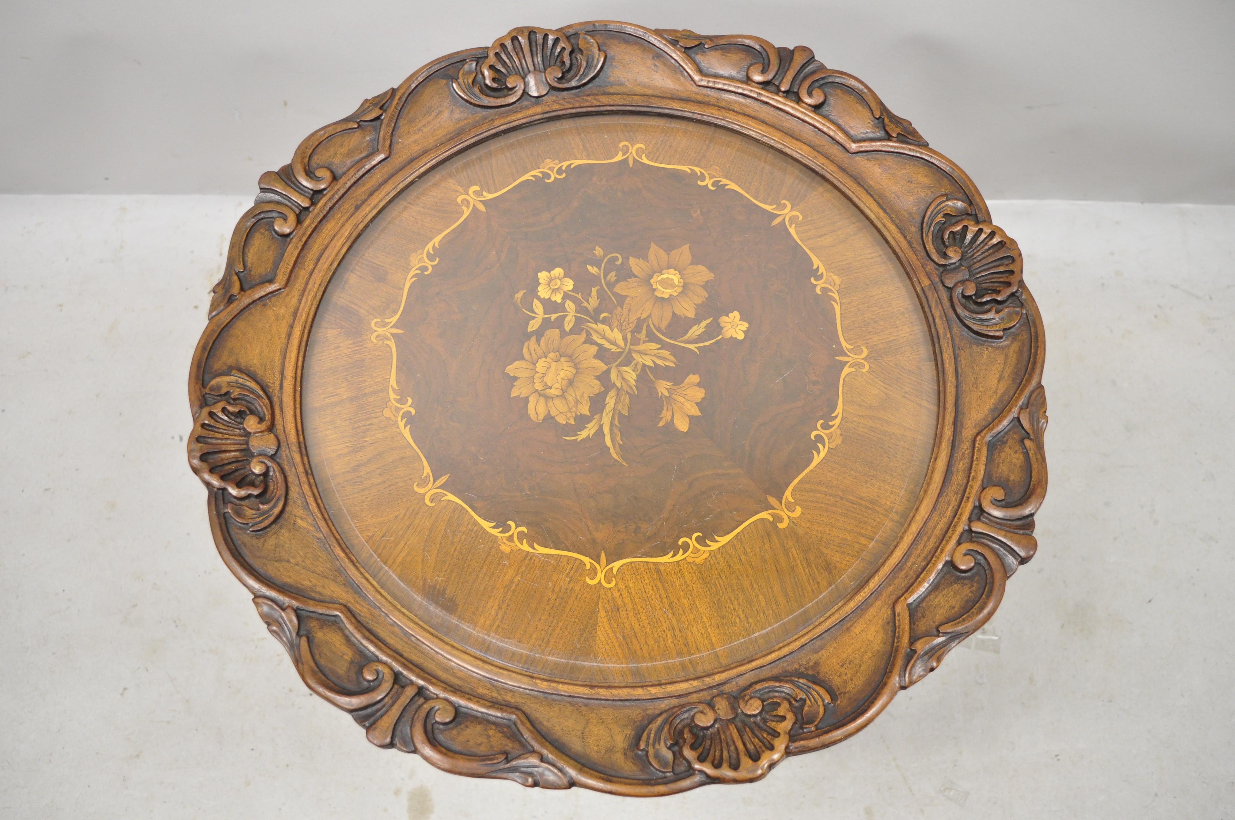 French Louis XV Regency shell carved floral inlay glass tray top coffee table. Item features beveled glass top, carved shell form lower shelf, satinwood floral inlay, beautiful wood grain, nicely carved details, carved feet, very nice antique item,