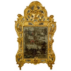 Miroir mural Louis XV Rococo 18ème siècle en bois sculpté et doré avec panier de fleurs