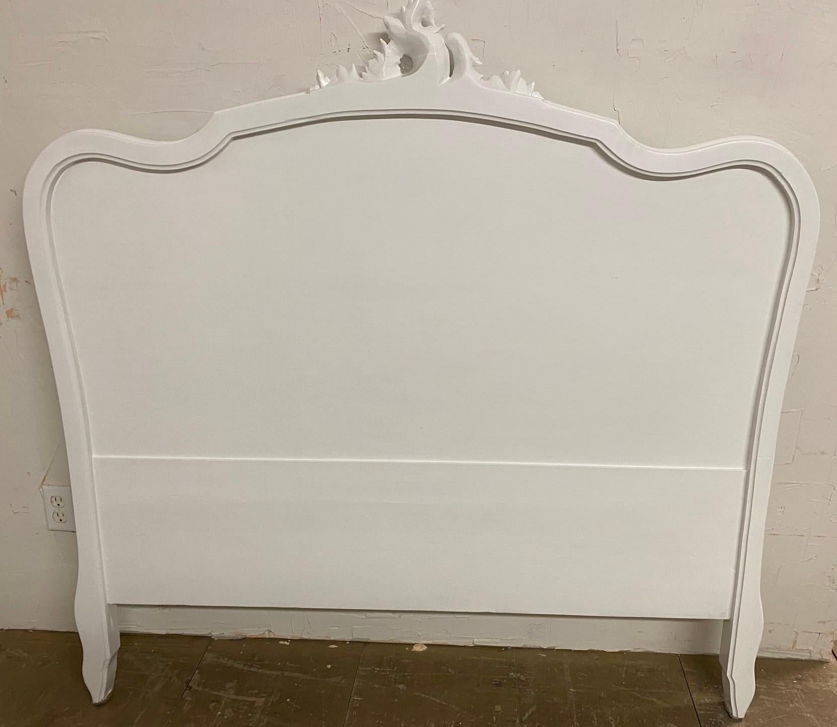 Double size Rococo Louis XV style carved French walnut bed painted white.  Nicely carved cabriole legs with shells and finely carved crest on head board.
Dimensions: 56