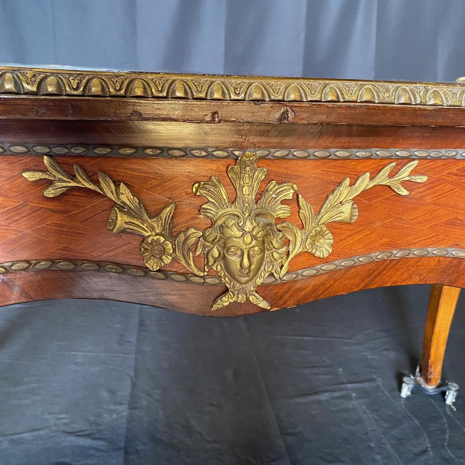 Elegant French Louis XV style writing desk or bureau plat desk with stunning diamond marquetry on drawers.  Lovely versatile medium size, stunning bronze figural female bust mounts on all legs, faux drawers to rear (so two sided), 3 functioning