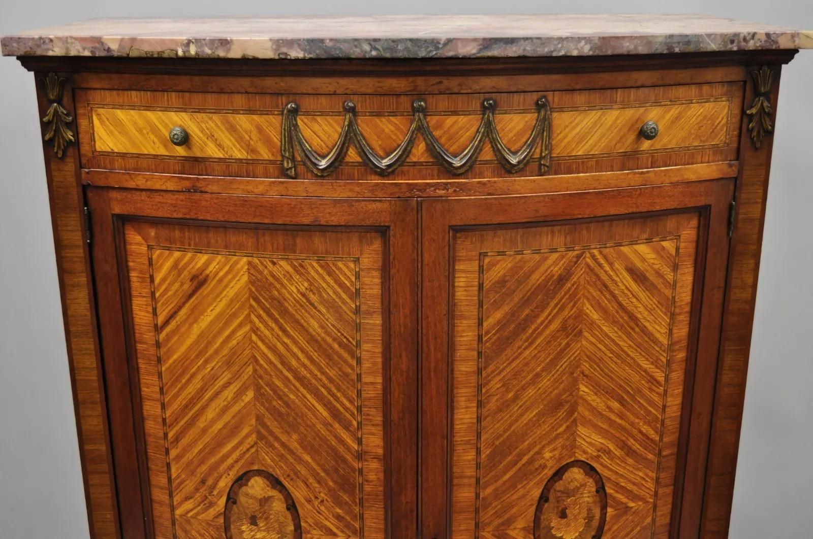 Early 20th Century French Louis XV Style Satinwood Inlaid Pink Marble Top Tall Chest. Item features satinwood inlay, pink shaped marble top, inlaid sides, bow front, working lock and key, 6 dovetailed drawers, cabriole legs, very nice antique item.
