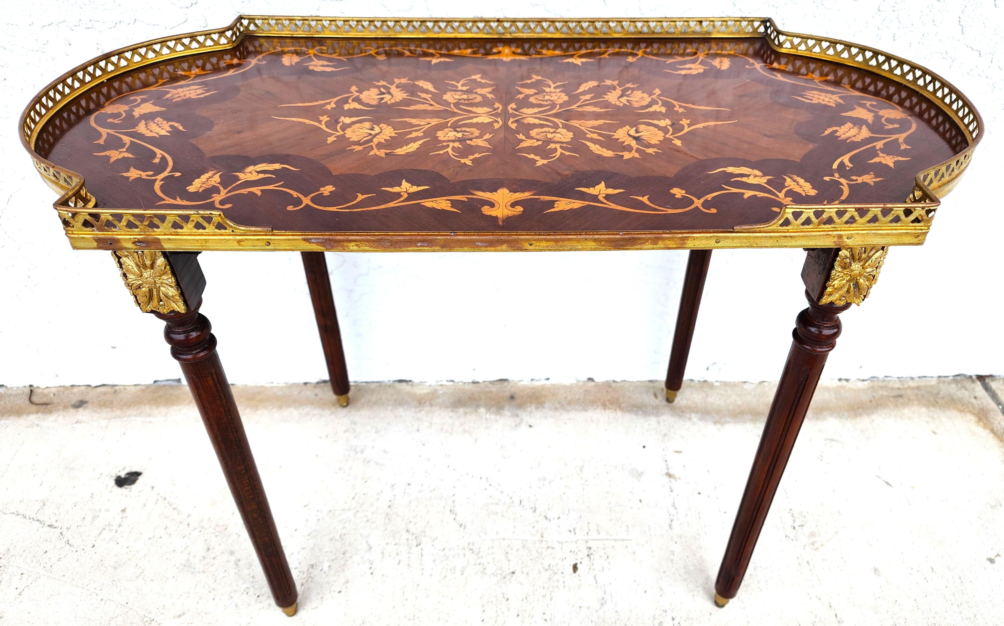 For FULL item description click on CONTINUE READING at the bottom of this page.

Offering One Of Our Recent Palm Beach Estate Fine Furniture Acquisitions Of A
Mid-Century Louis XV Style Accent Serving Tray Table with Inlaid Design, Brass Galery,
