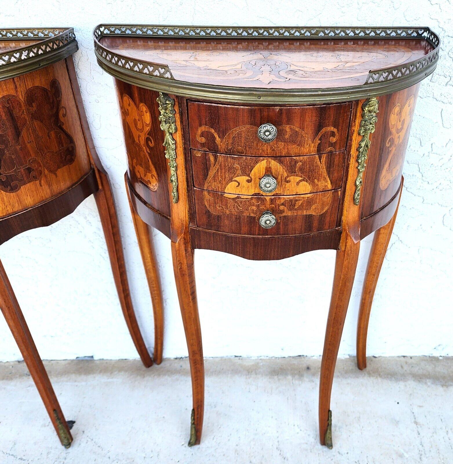 For FULL item description click on CONTINUE READING at the bottom of this page.

Offering One Of Our Recent Palm Beach Estate Fine Furniture Acquisitions Of A
Pair of French Louis XV Side Accent Bedside Tables
With inlaid marquetry designs, 3