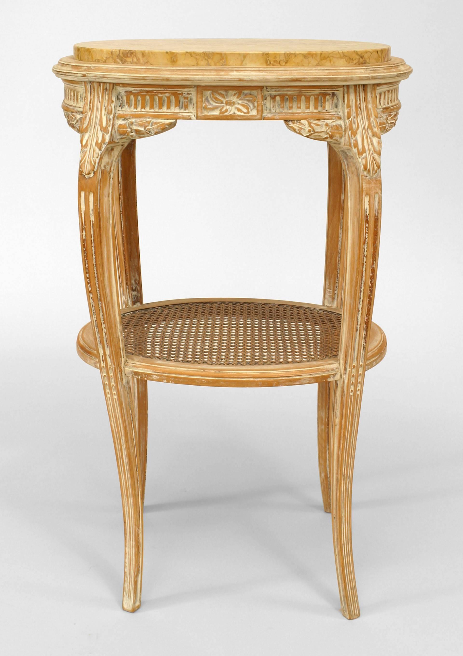 French Louis XV-style (19th Century) bleached oval end table with cane shelf and marble top.
