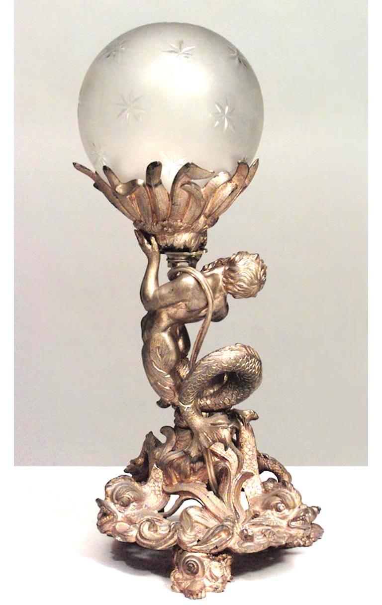 French Louis XV-style (19th Century) bronze dore table lamp with Neptune & dolphins at base holding glass globe with etched stars fabricated from a compote base.
