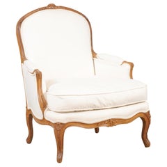 French Louis XV Style 19th Century Bergère Chair with Carved Floral Motifs