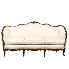 French Louis XV Style 19th Century Hand-Carved Walnut Canapé with New Upholstery
