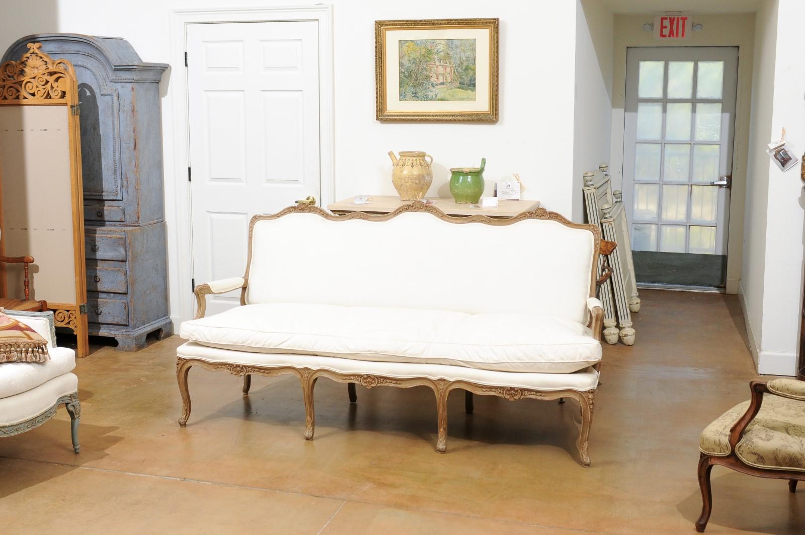 French Louis XV Style 19th Century Three-Seat Painted and Floral Carved Canapé In Good Condition In Atlanta, GA