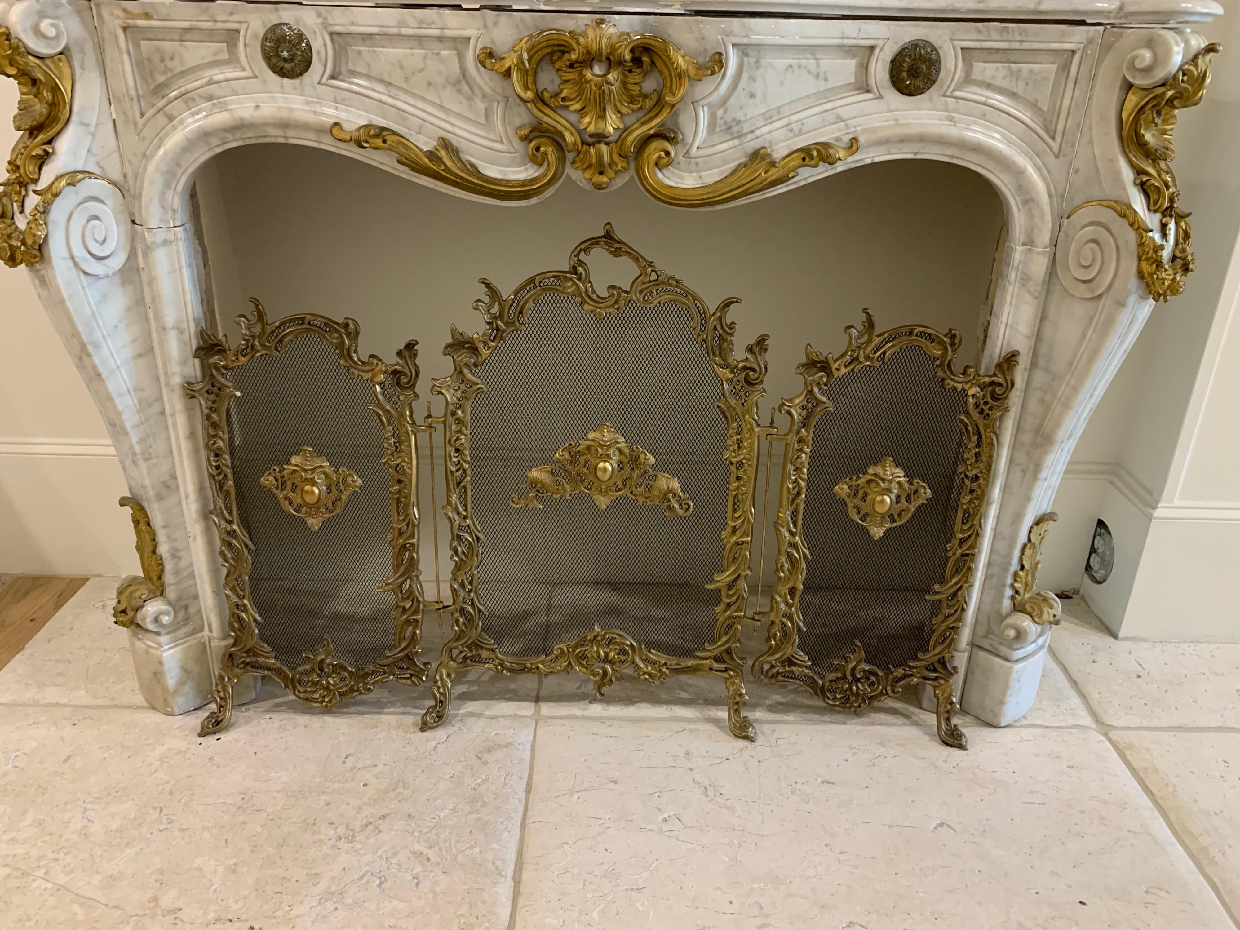 Very fine large French Louis XV style 3-panel fire screen. Gorgeous bronze details including crest like images and other intertwined pieces. Creates a real touch of elegance!