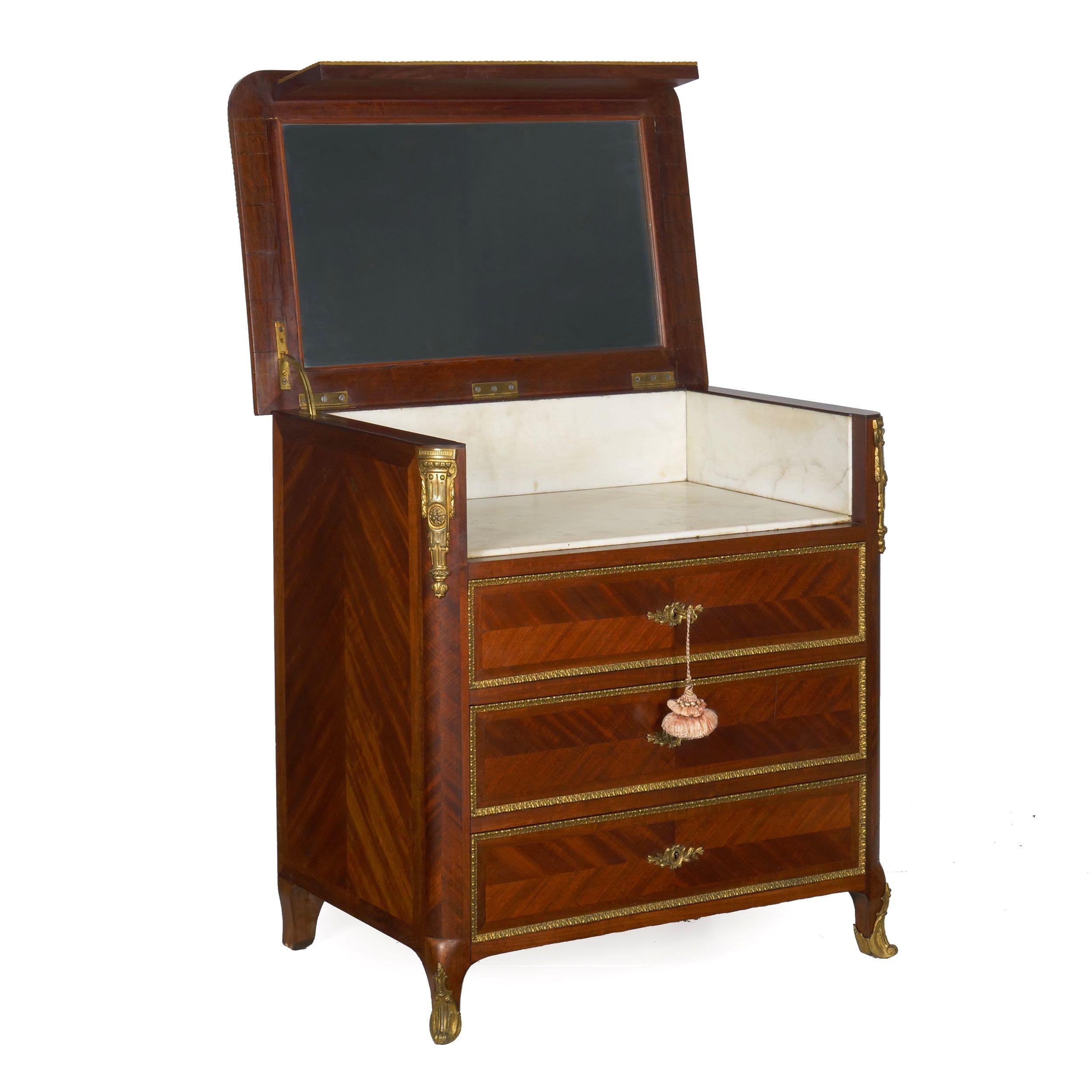 FRENCH ORMOLU MOUNTED PARQUETRY DRESSING COMMODE
With marble lined and mirrored interior, circa late 19th century
Item # 007EPG30

A refined little dressing commode in the Louis XV taste from the Belle Epoqué period, it presents as a chest of