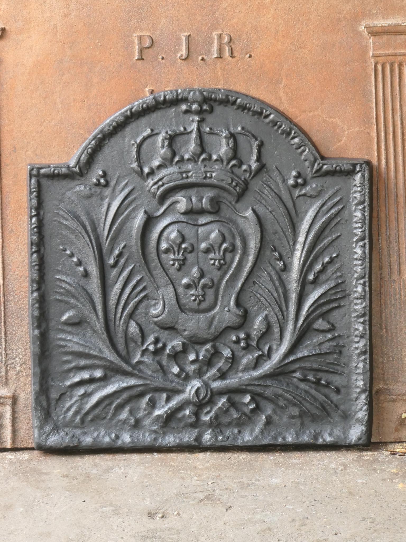 20th Century French Louis XV style fireback with the arms of France. This is the coat of arms of the House of Bourbon, an originally French royal house that became a major dynasty in Europe. It delivered kings for Spain (Navarra), France, both