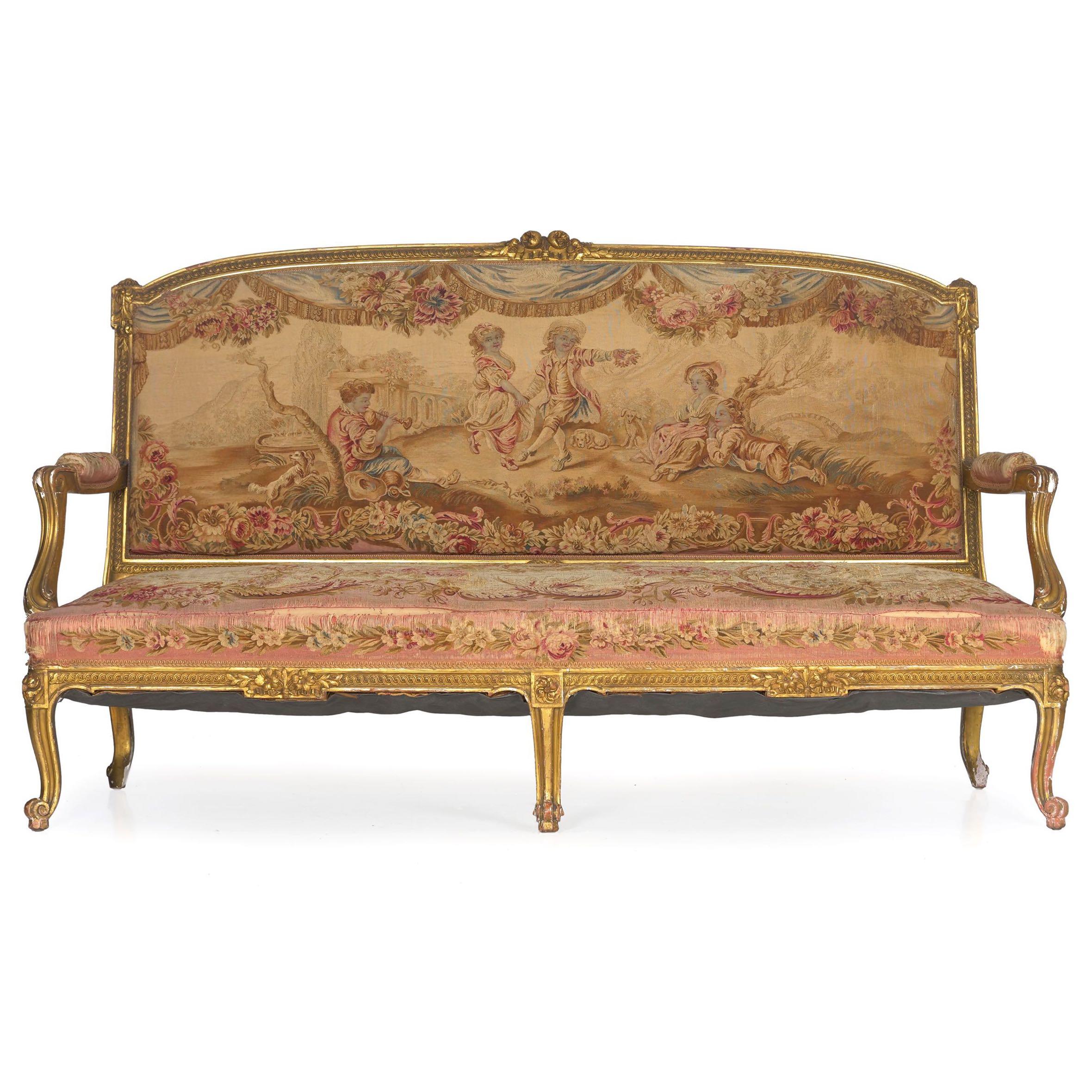 A very high quality Parisian settee from the turn of the century during the height of the Belle Époque, this exceptional seating piece features an early Aubusson handstitched covering. 

There is a boldness in the form of the frame that is