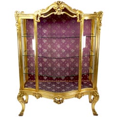 Cabinet Vitrine francese in stile Luigi XV "Belle Époque" in legno dorato intagliato con fronte ad arco