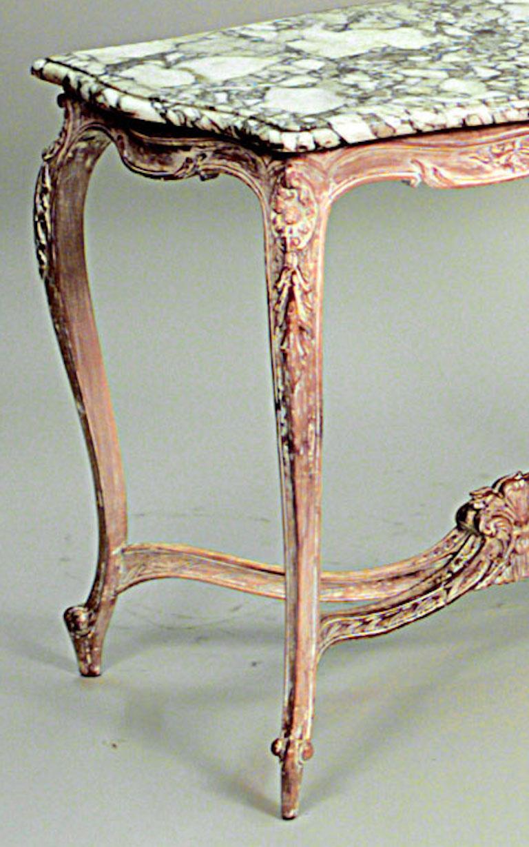 French Louis XV style (19/20th Century) bleached center table with serpentine shape white marble top and carved stretcher.
