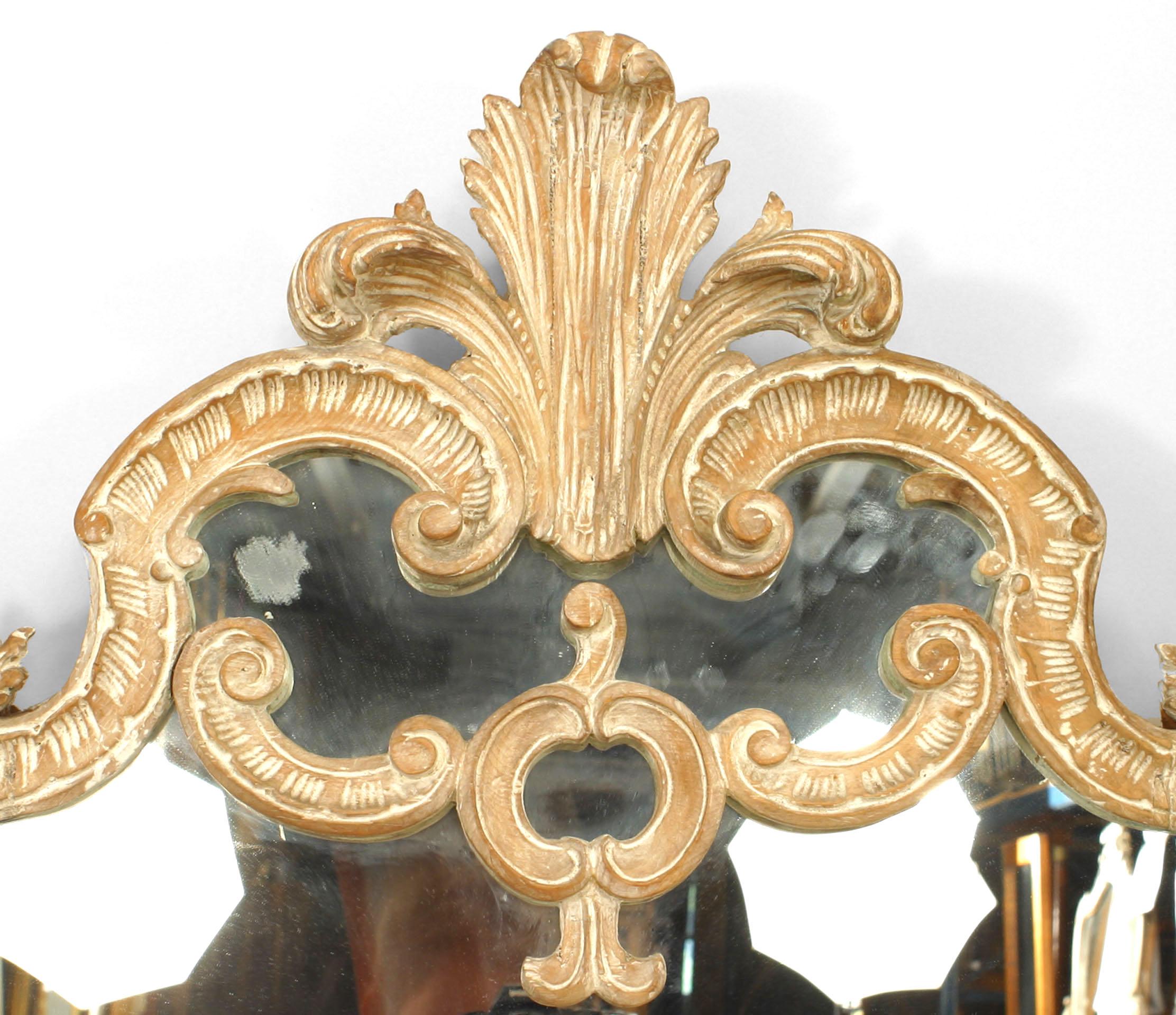 French Louis XV-style (19th/20th Century) horizontal bleached wood wall mirror with a carved scroll design and triple plume top.
