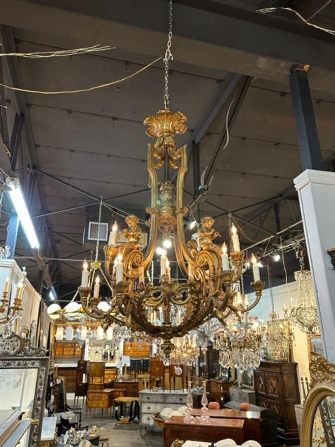 19th century French Louis XV style gild bronze chandelier, circa 1860. The chandelier has been professionally rewired, comes with matching chain and canopy. It is ready to hang!