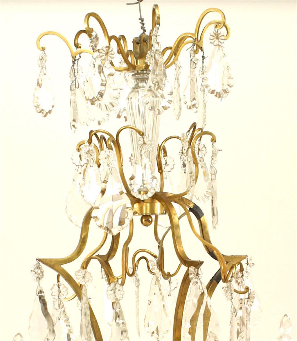 French Louis XV-style (20th Century) bronze dore and crystal 8 arm chandelier
