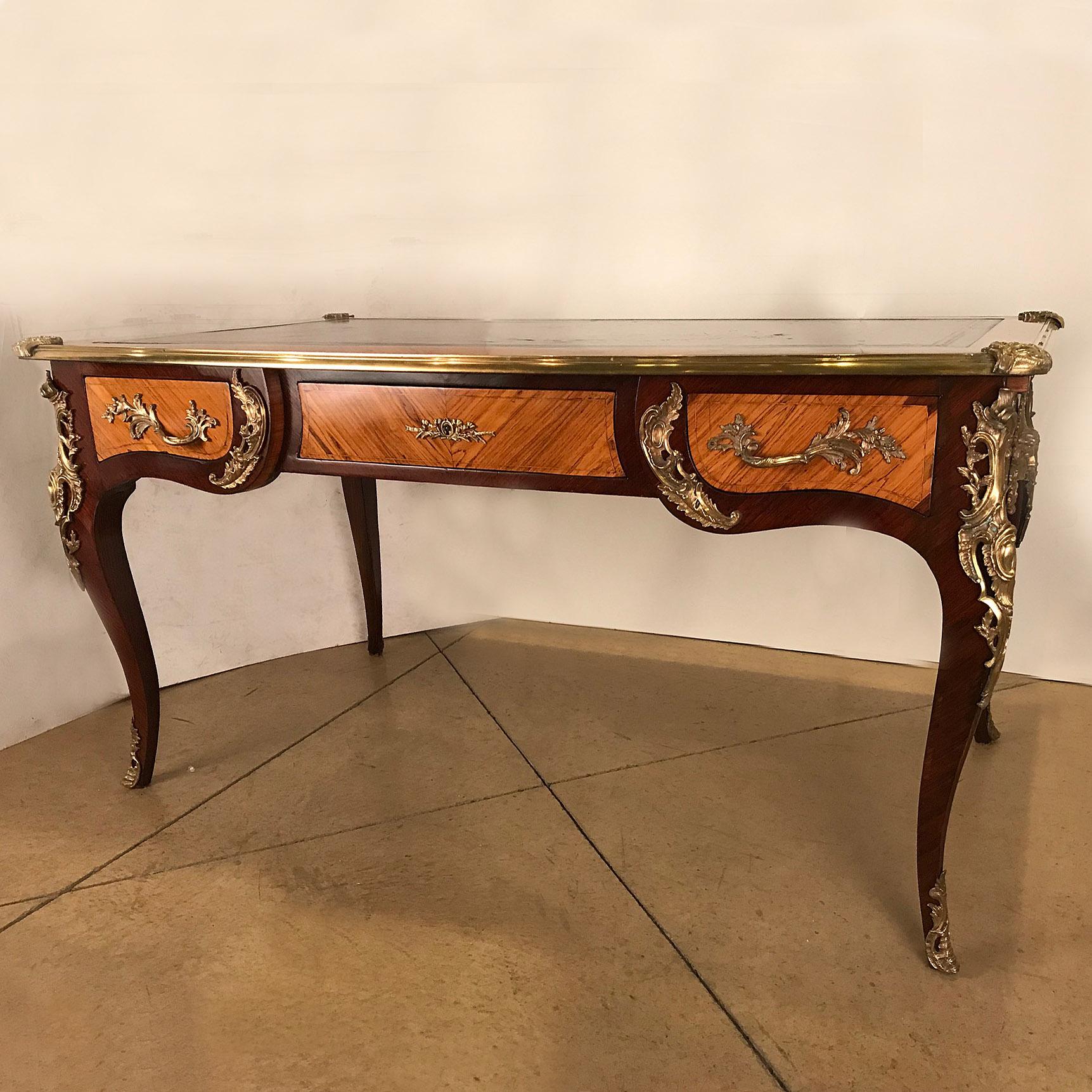 This fine piece dates from the third quarter of the 19th century and has many of the characteristics of a period piece, although made later. The mahogany is exceptionally well-chosen, the bronze mounts are of high quality and well modelled. The desk
