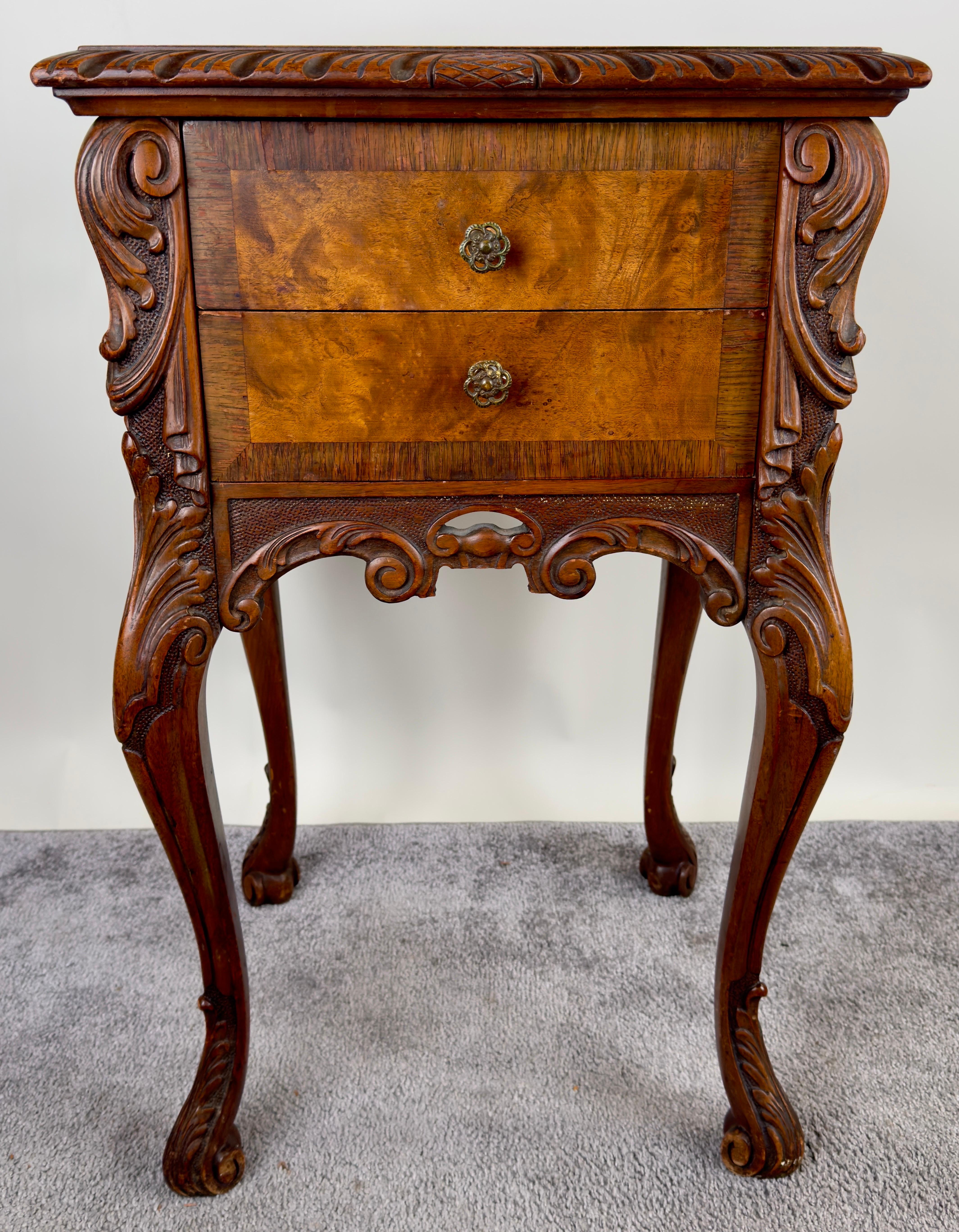 A 19th-century Burl Walnut nightstand or end table showing exquisite craftsmanship and made of quality burl walnut, a wood that has graced the most distinguished furniture throughout history.
The sturdy and well-made  table boasts a lavishly carved