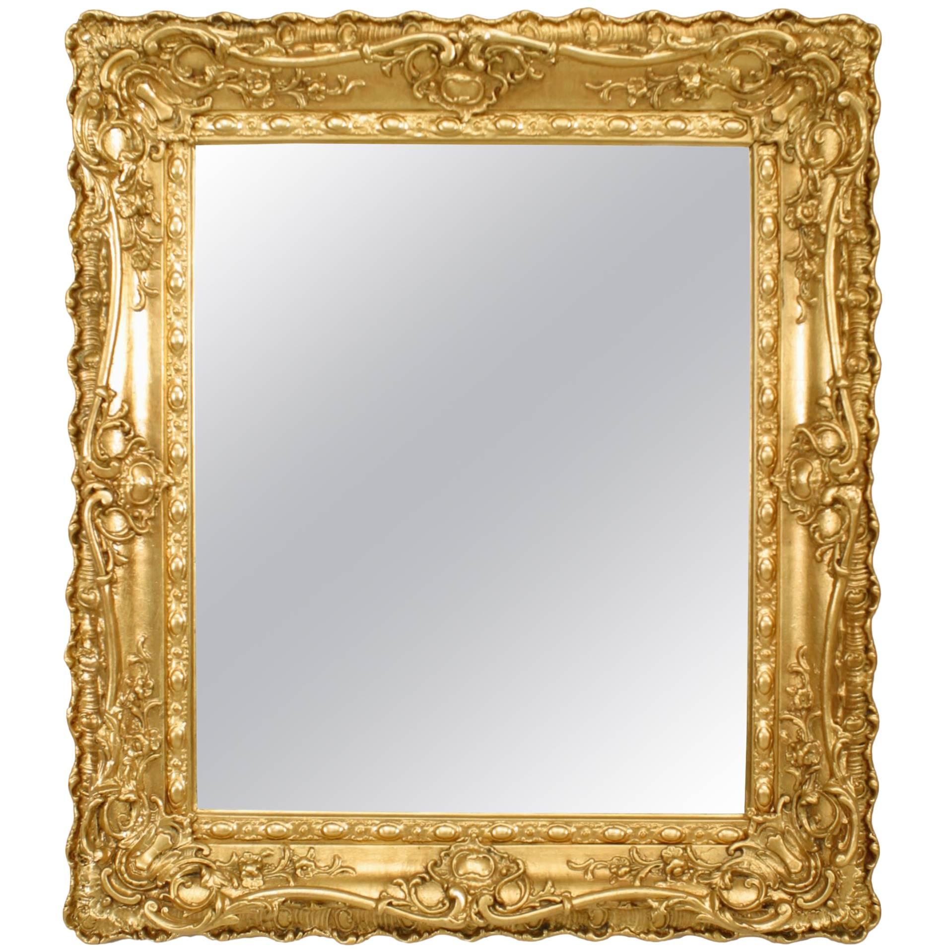 Specchio da parete in legno dorato intagliato in stile Luigi XV francese