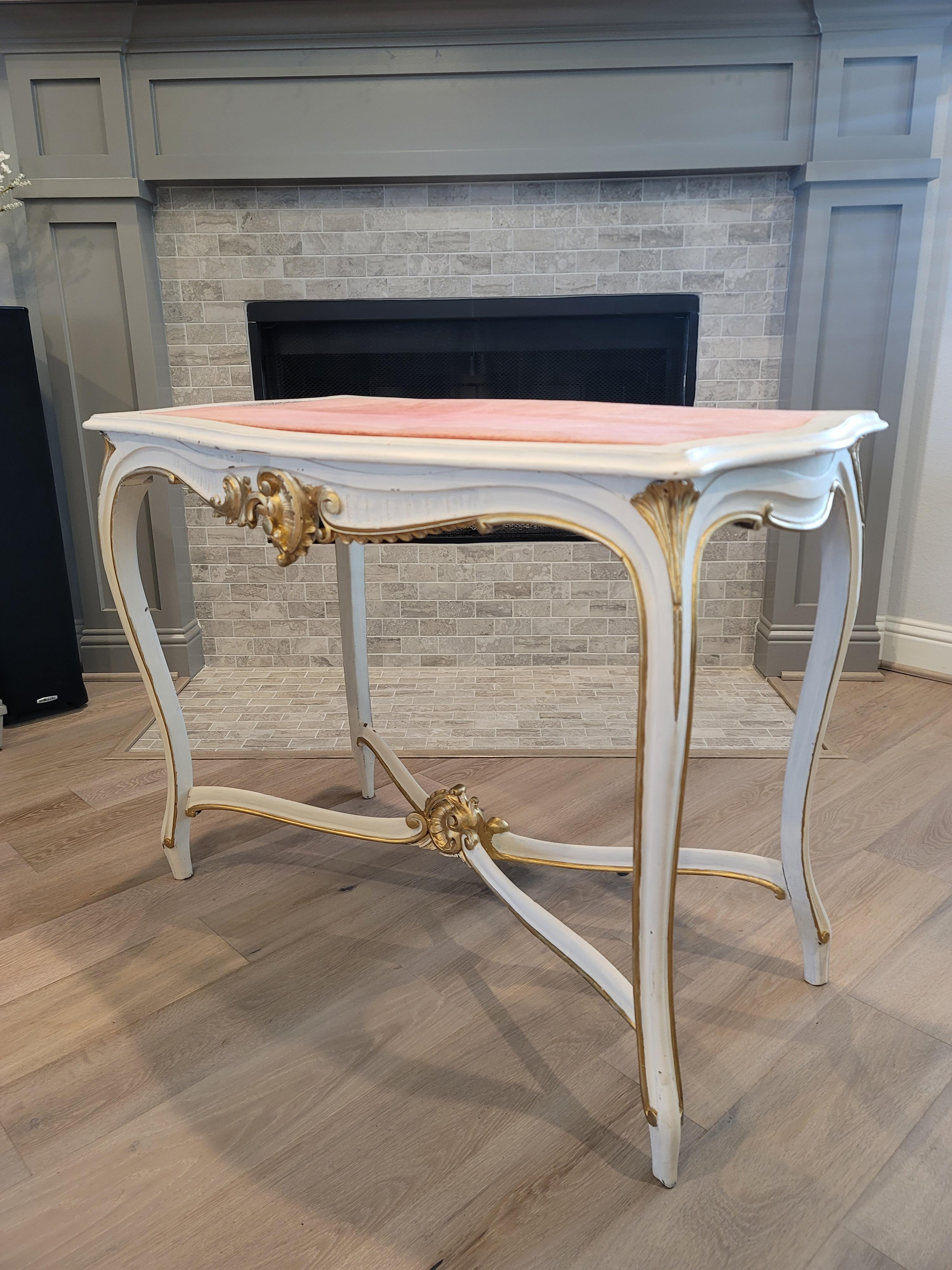 A elegant vintage French Louis XV style hand carved and painted center table with giltwood accents. 

Add a touch of timeless sophisticated elegance and luxurious romantic warmth to any space with this striking 18th century Louis XV style table.
