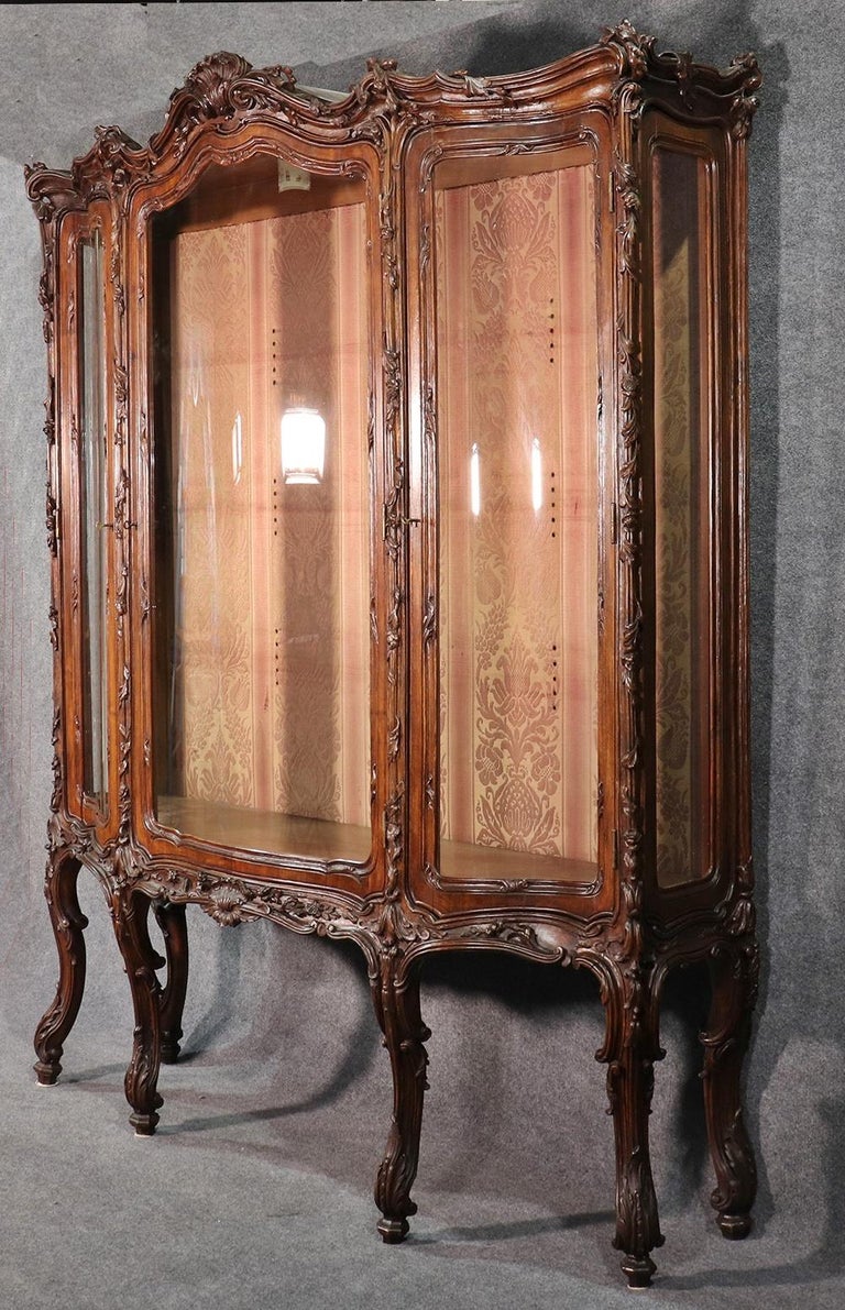French Louis XV Style Carved Walnut Breakfront China Cabinet at 1stDibs