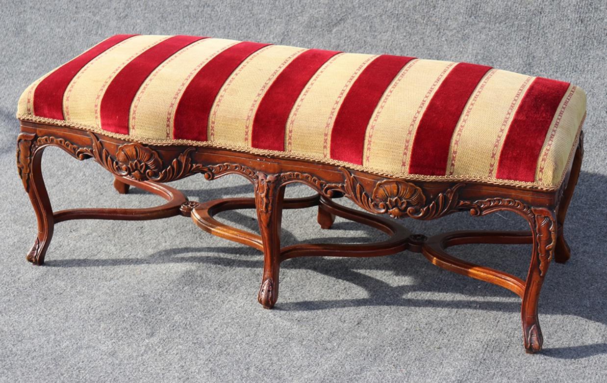 This is a beautiful French Louis XV style simply carved walnut double window bench with outstanding upholstery.