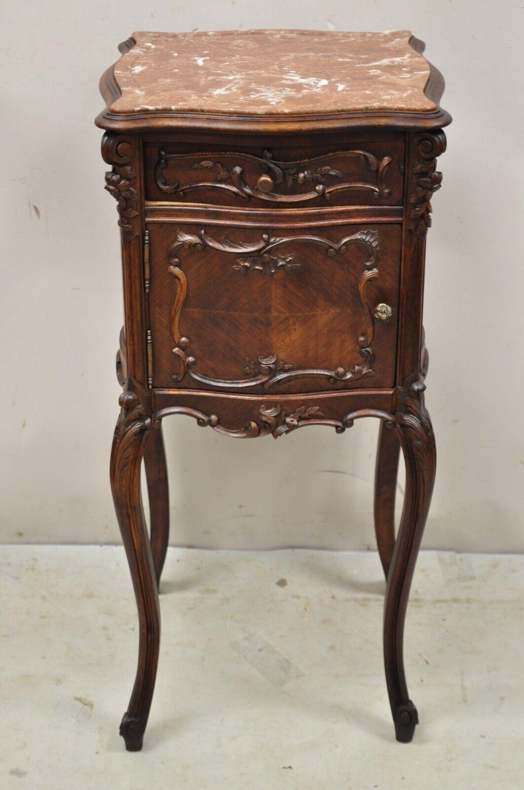 Antique French Louis XV Style Carved Walnut Marble Top Porcelain Lined Washstand Nightstand. Item features a porcelain lined interior, inset pink rouge marble top, nicely carved details, 1 swing door, 1 dovetailed drawer, carved ball and claw feet,