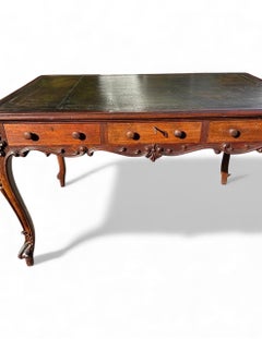 French Louis XV Style Carved Walnut Partners Desk with Leather Top..