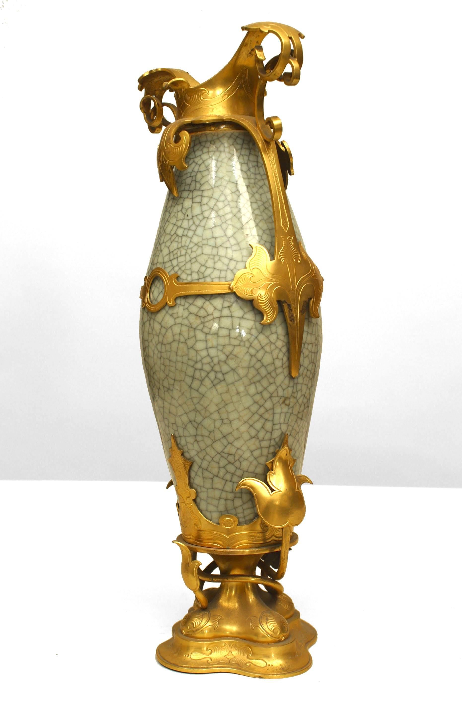 French Louis XV style celadon crackled design porcelain vase with bronze dore floral base and scroll top (19/20th Cent.)
