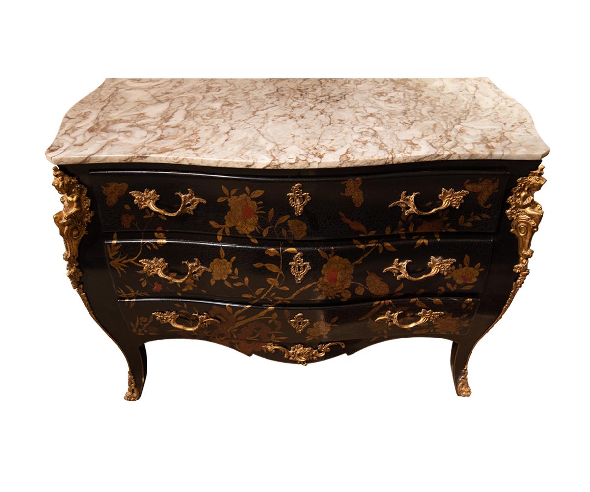 Offered is this very Fine a French Louis XV style three drawers bombe or commode with marble top and gold gilt bronze accents. It is painted black with chinoiserie flowers and gilded gold cherubs with ormolu.